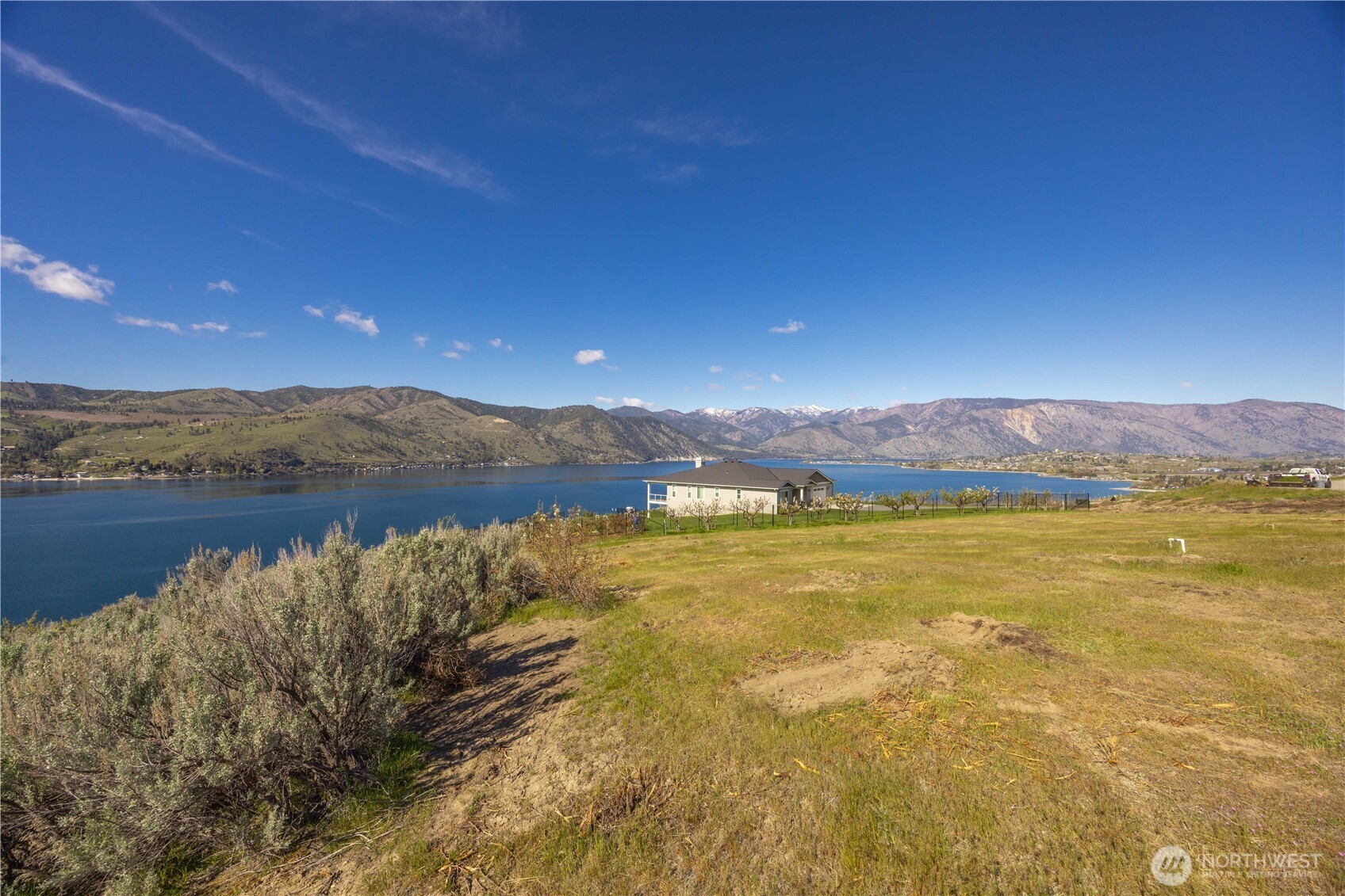 0 Rocky Point Lane Manson, WA 98831 - Photo 14 of 20 a view of an ocean and a mountain