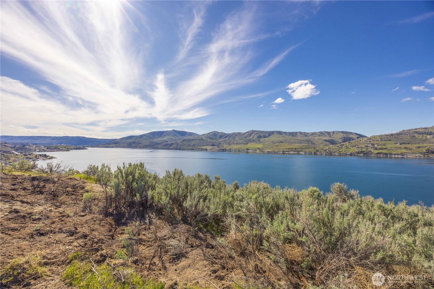 0 Rocky Point Lane Manson, WA 98831 - Photo 17 of 20 a view of lake with mountain in background