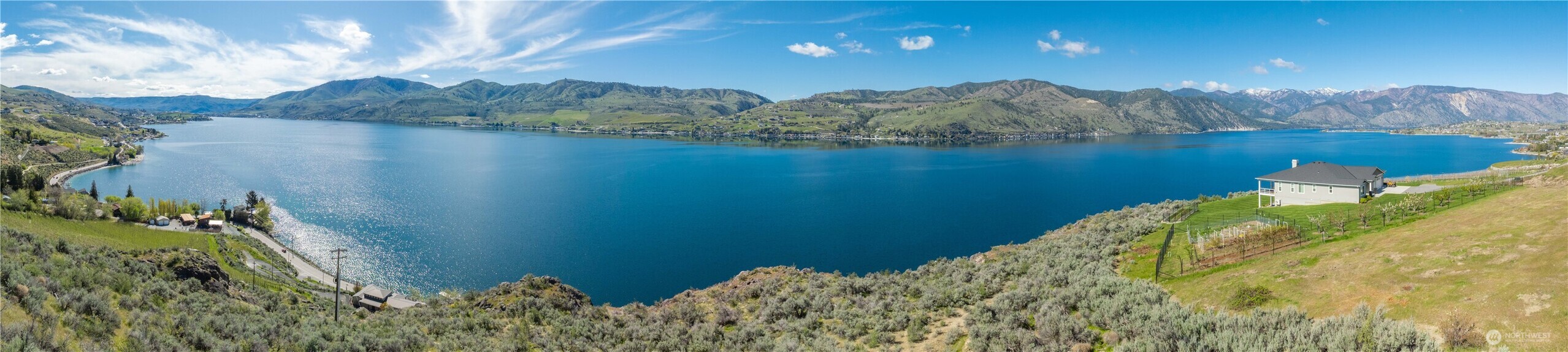 0 Rocky Point Lane Manson, WA 98831 - Photo 3 of 20 a view of a lake with a mountain in the background