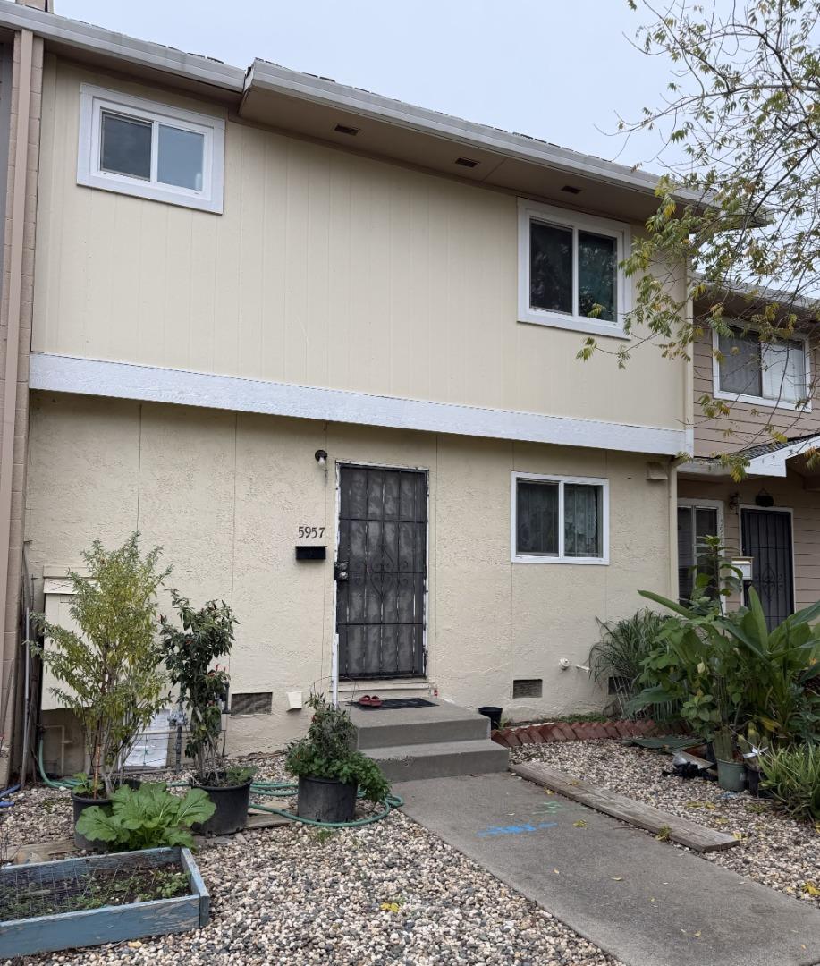 5957 Mack Road Sacramento, CA 95823 - Photo 1 of 9 a front view of a house with garden