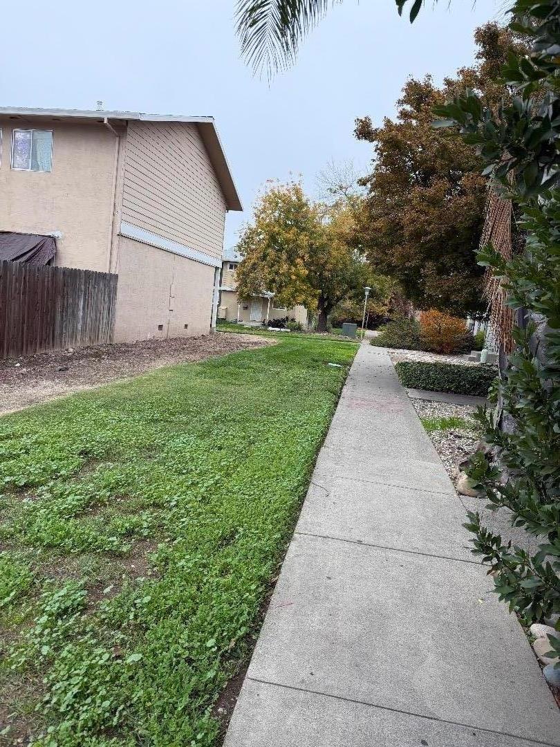 5957 Mack Road Sacramento, CA 95823 - Photo 2 of 9 a view of a backyard with potted plants