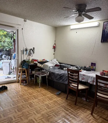 a room with furniture a rug and a window