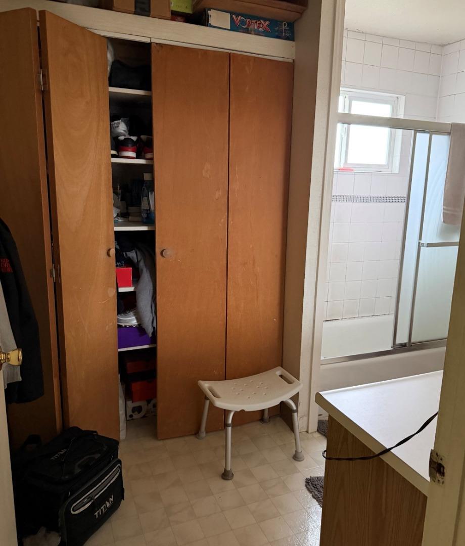 5957 Mack Road Sacramento, CA 95823 - Photo 6 of 9 a room that has a bed and a chair in it