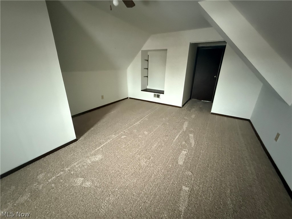3612 Riverside Avenue Cleveland, OH 44109 - Photo 21 of 22 Carpeted room with sloped walls and a built-in shelving niche