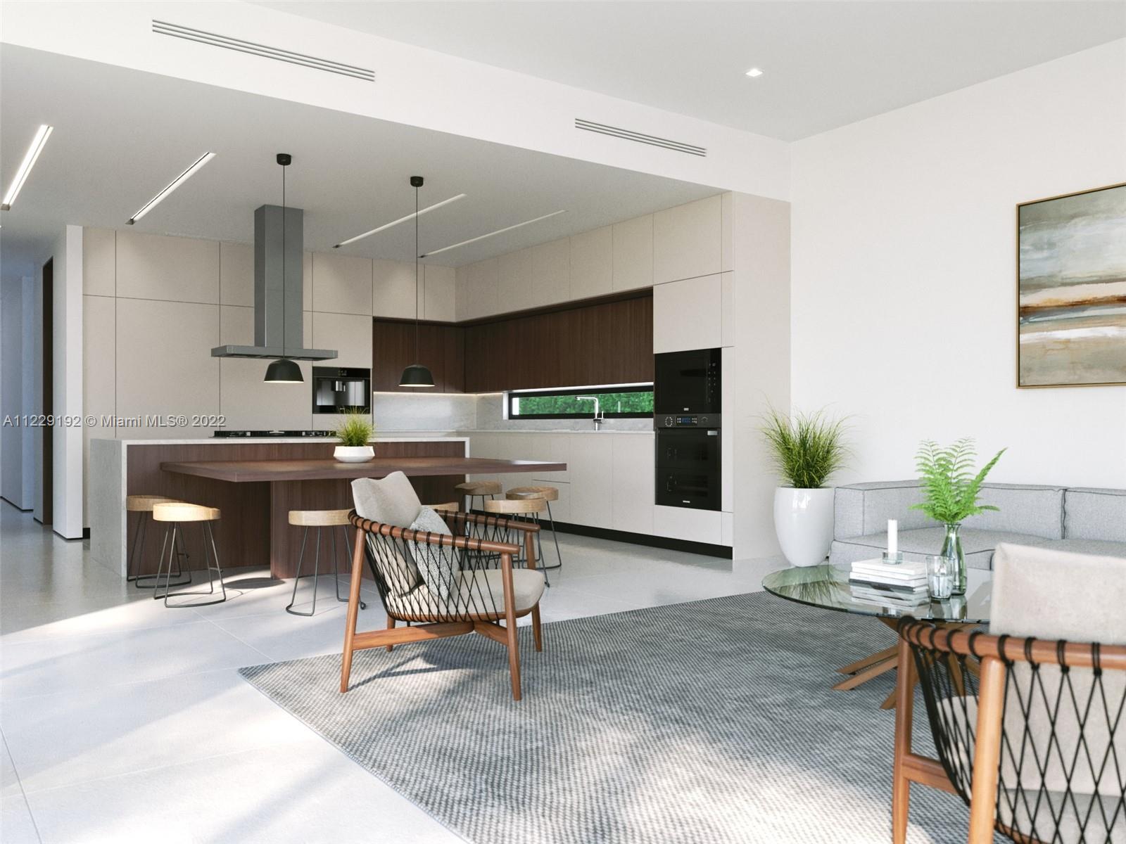 7325 Belle Meade Boulevard Miami, FL 33138 - Photo 6 of 8 a workspace with furniture and a kitchen