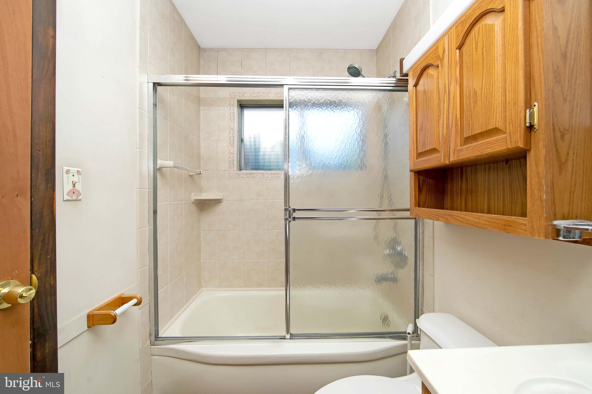 12 Geranium Road Levittown, PA 19057 - Photo 14 of 38 a bathroom with a shower and bathtub