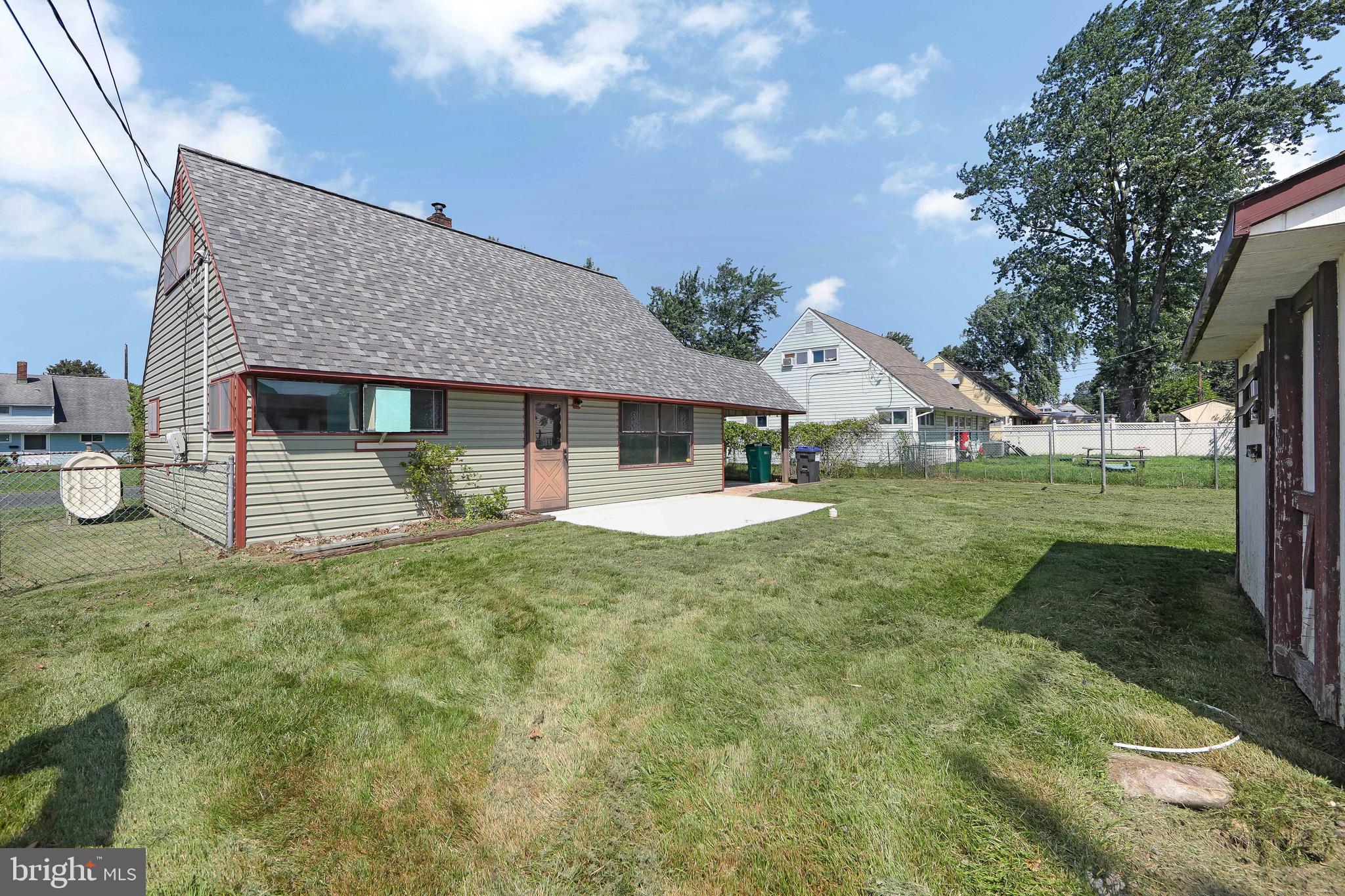 12 Geranium Road Levittown, PA 19057 - Photo 37 of 38 a view of a house with backyard and sitting area
