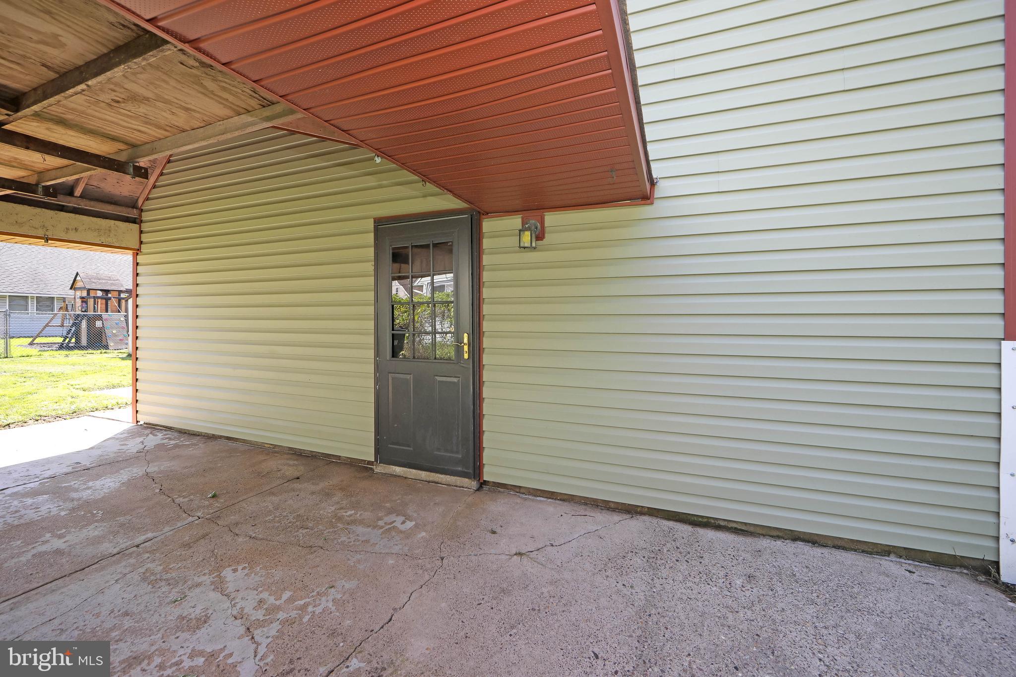 12 Geranium Road Levittown, PA 19057 - Photo 5 of 38 a view of a house with a yard and a garage