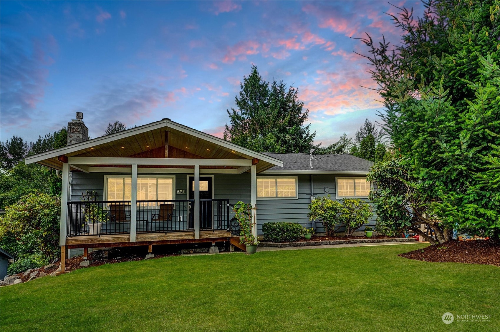 12451 169th Avenue Southeast Renton, WA 98059 - Photo 1 of 40 a front view of a house with a garden