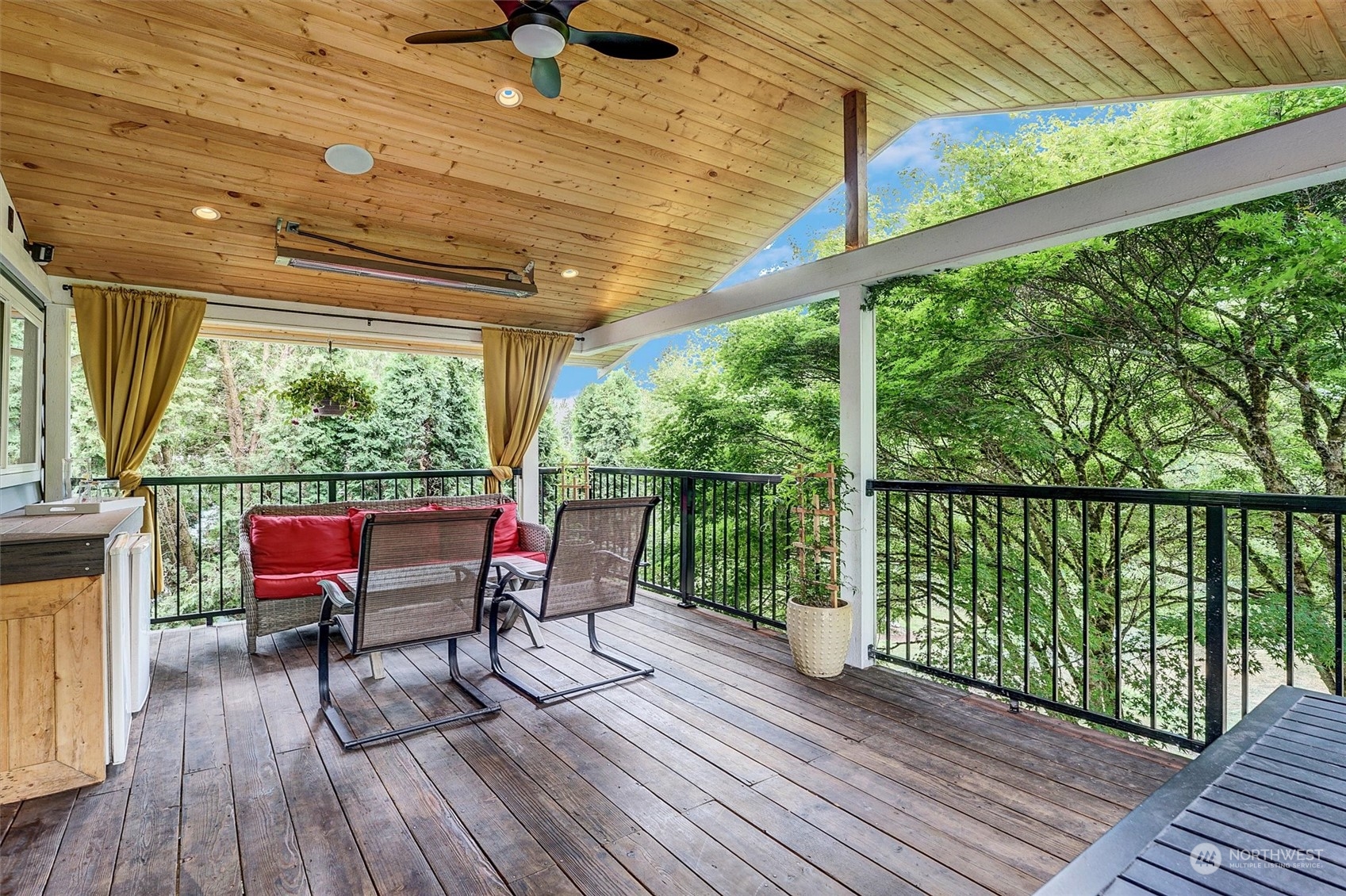 12451 169th Avenue Southeast Renton, WA 98059 - Photo 14 of 40 a view of a chairs and table in patio with wooden floor