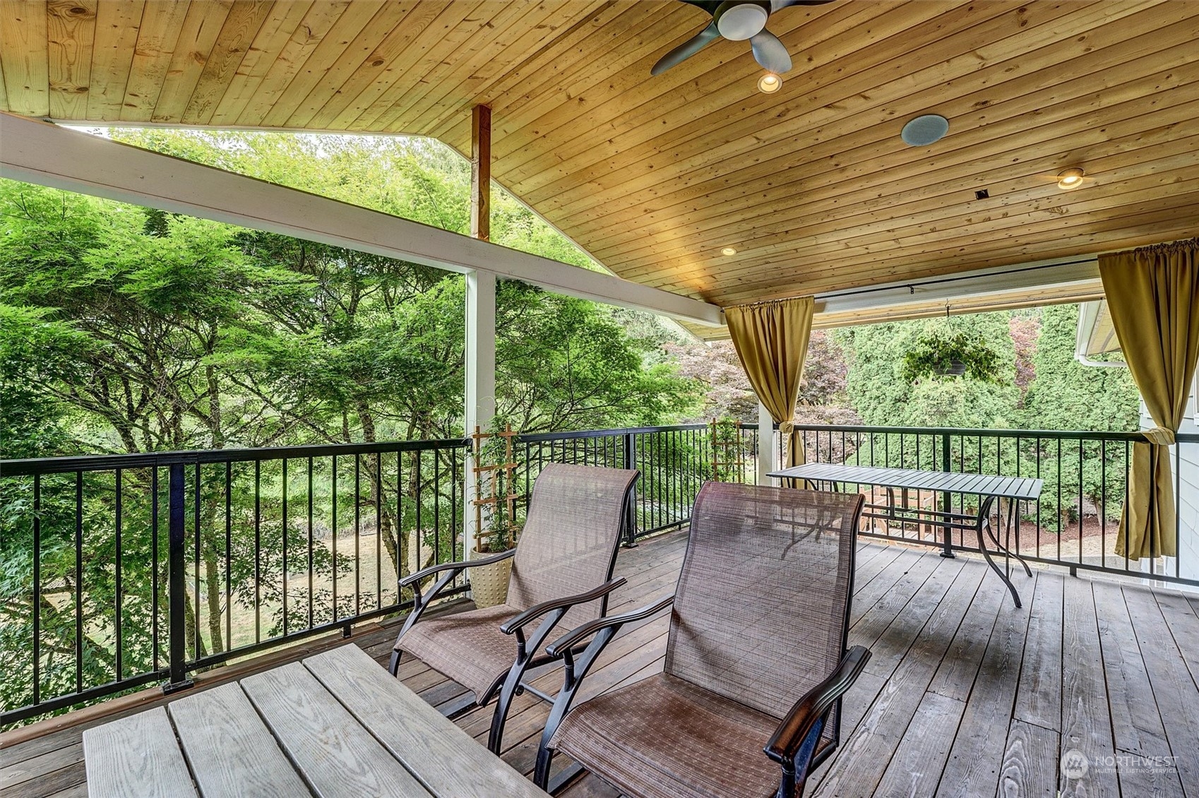 12451 169th Avenue Southeast Renton, WA 98059 - Photo 15 of 40 a view of a balcony with wooden floor and furniture