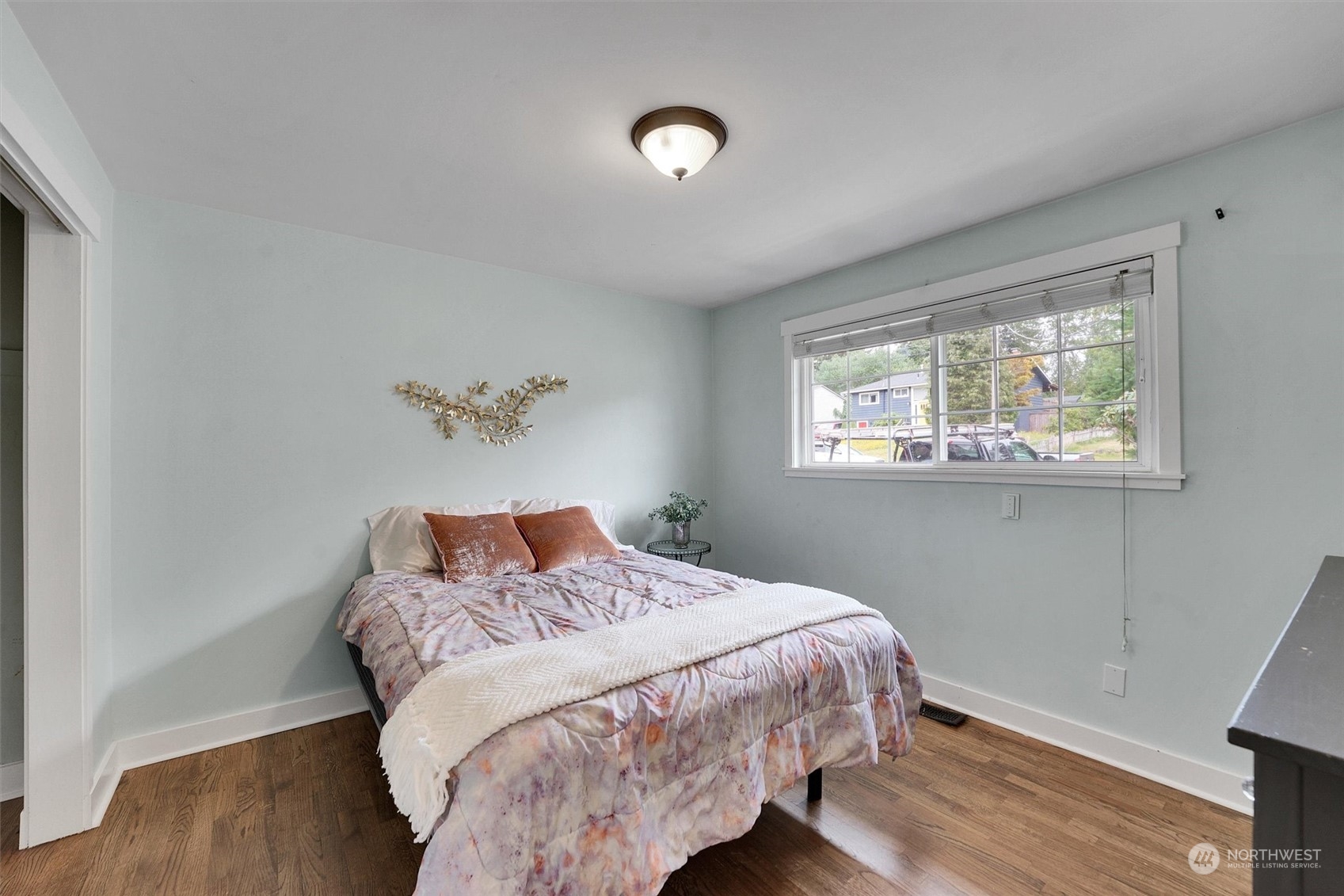 12451 169th Avenue Southeast Renton, WA 98059 - Photo 18 of 40 a bedroom with a bed and a window