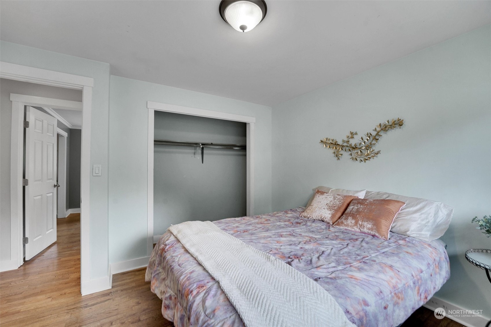 12451 169th Avenue Southeast Renton, WA 98059 - Photo 19 of 40 a bedroom with a bed and a potted plant