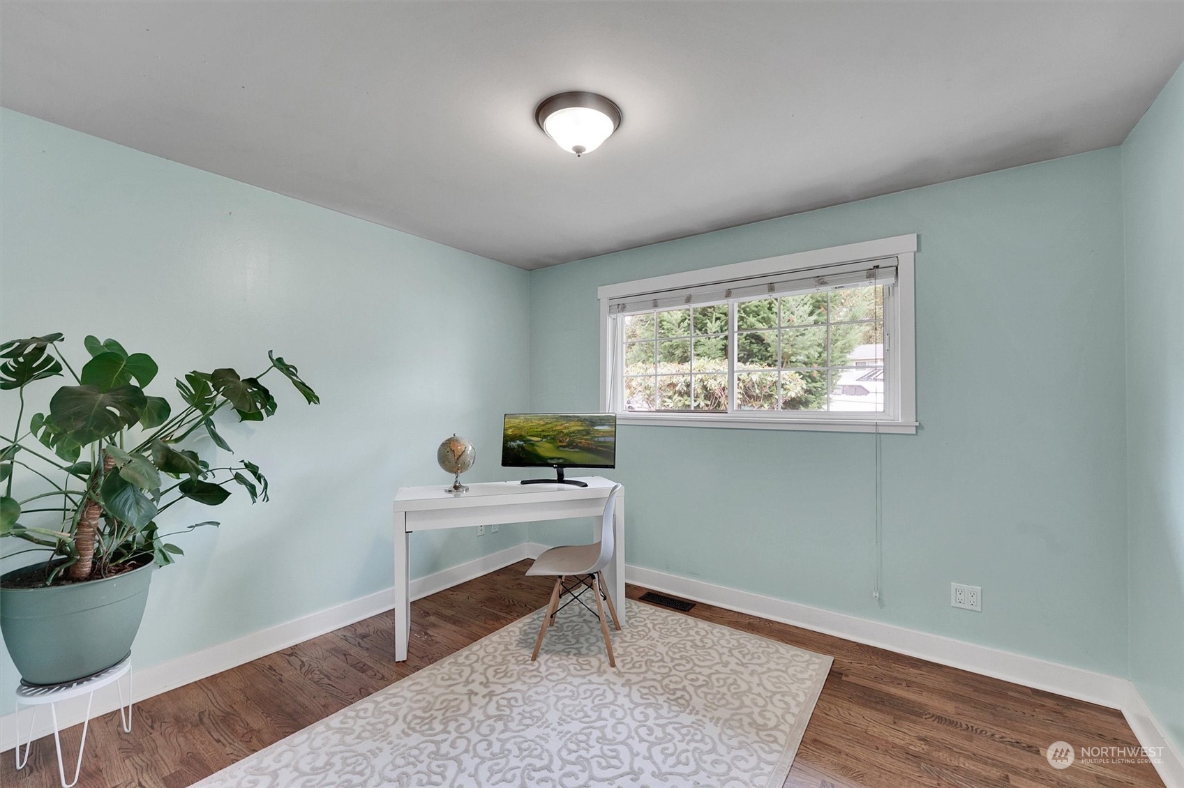 12451 169th Avenue Southeast Renton, WA 98059 - Photo 20 of 40 a workspace with furniture and a potted plant