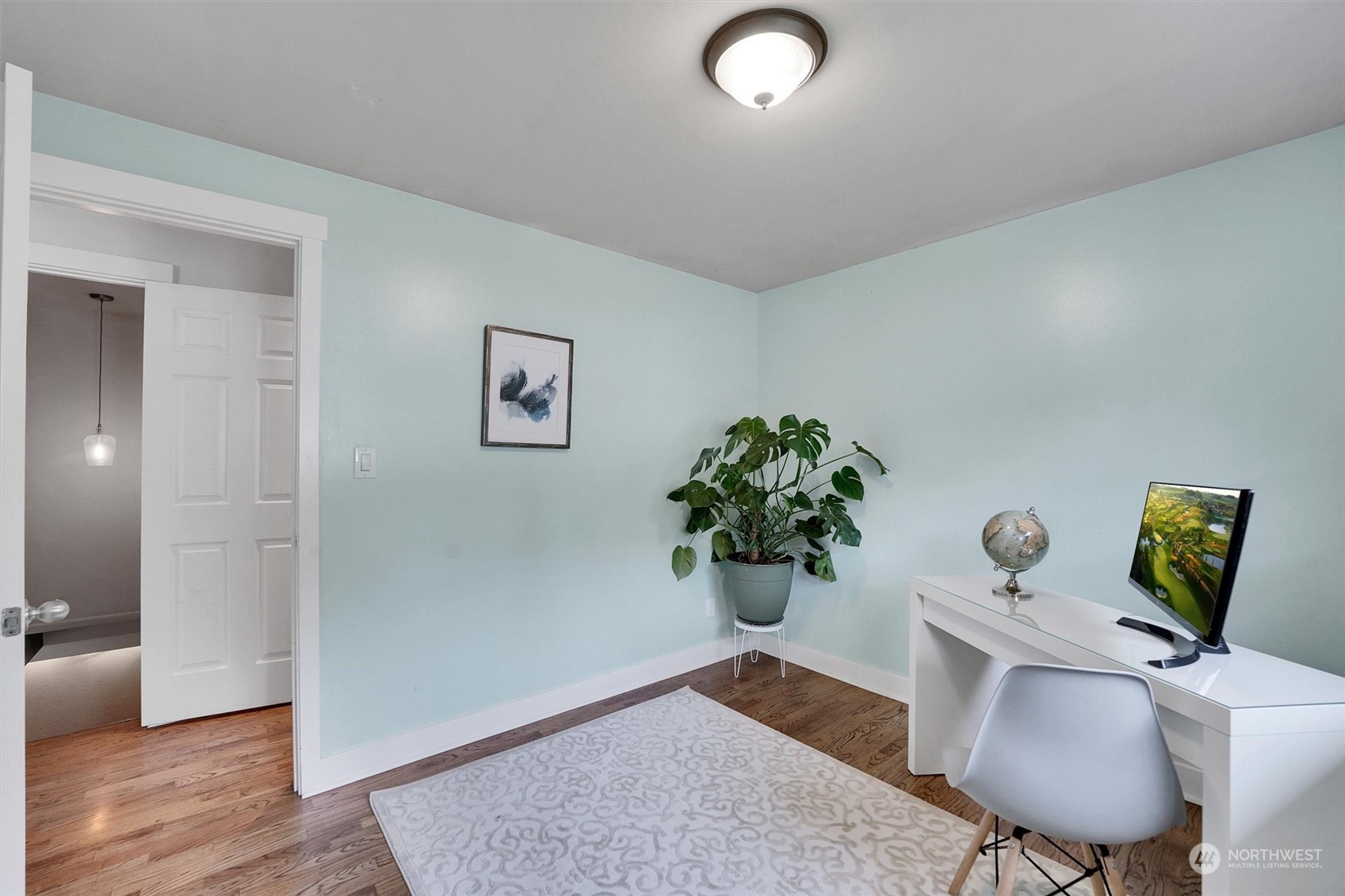 12451 169th Avenue Southeast Renton, WA 98059 - Photo 21 of 40 a living room with furniture and a potted plant