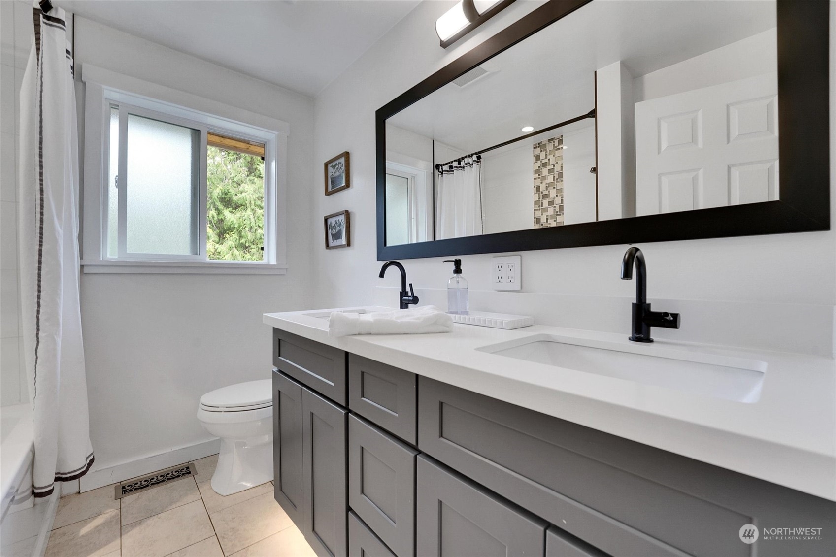 12451 169th Avenue Southeast Renton, WA 98059 - Photo 22 of 40 a bathroom with a sink and a toilet