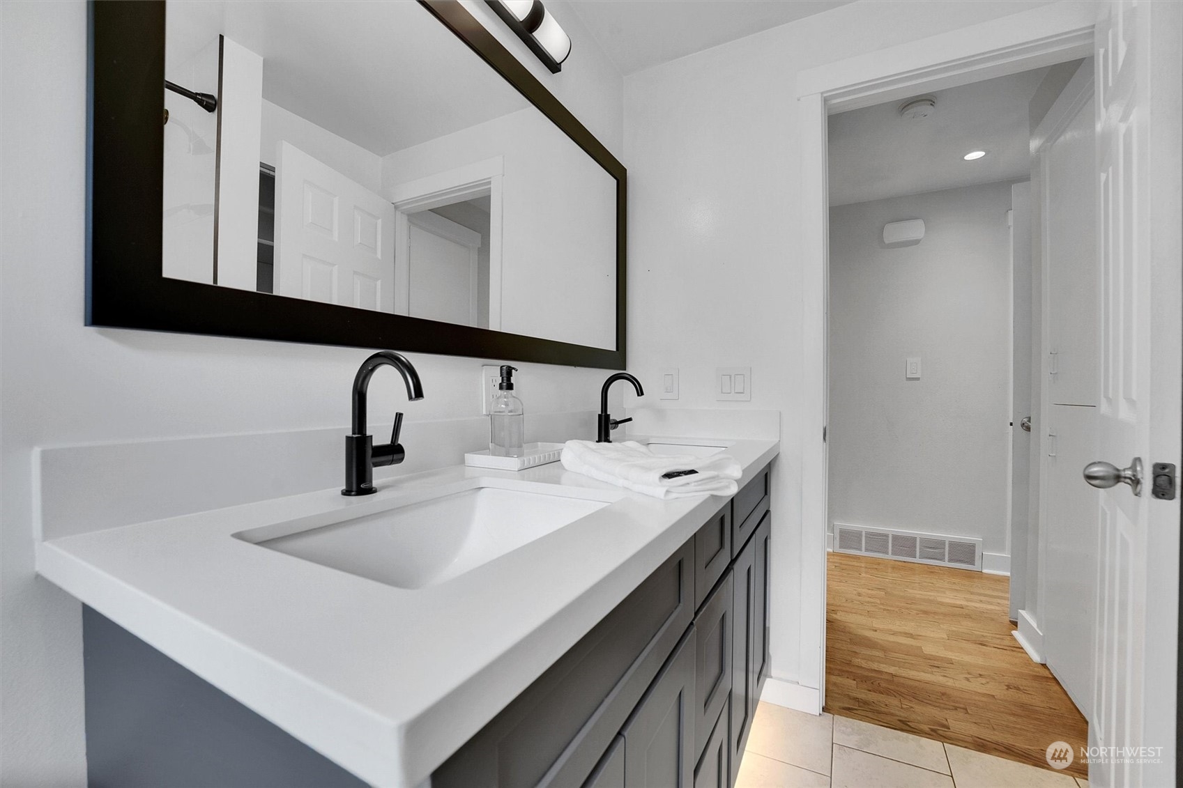 12451 169th Avenue Southeast Renton, WA 98059 - Photo 23 of 40 a bathroom with a sink and a mirror