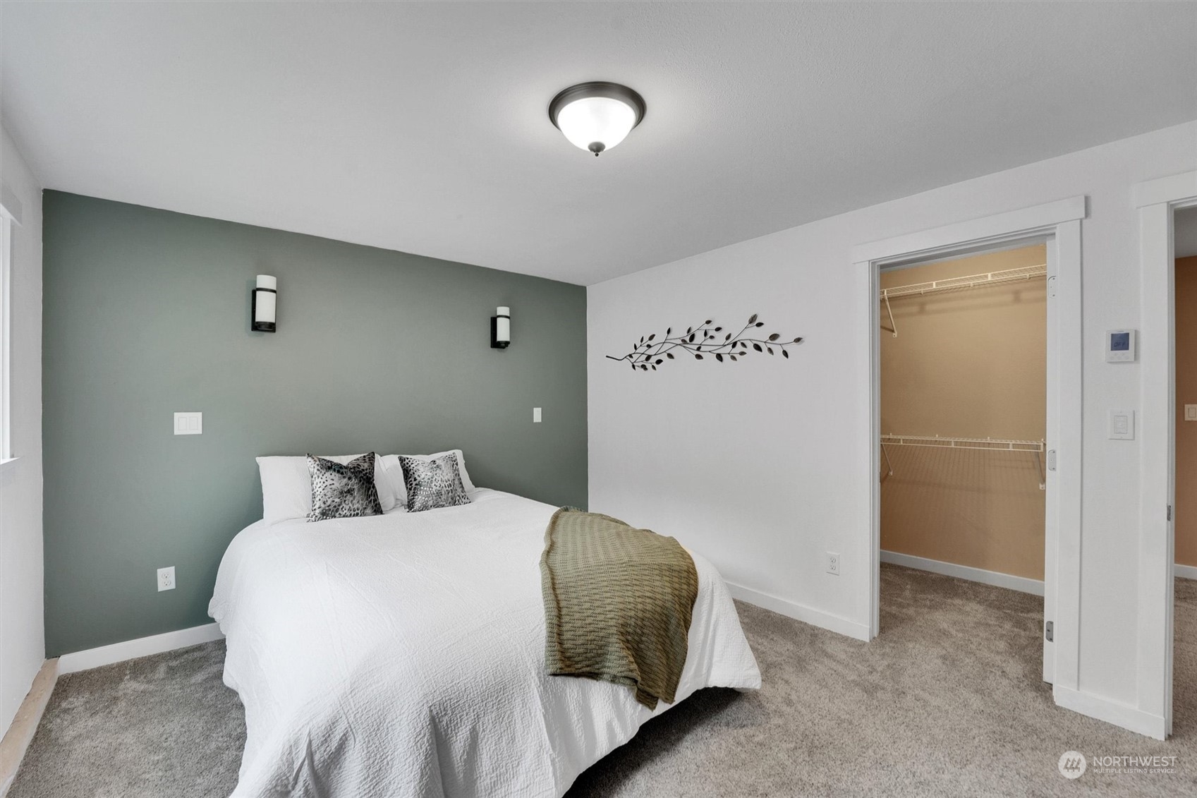 12451 169th Avenue Southeast Renton, WA 98059 - Photo 25 of 40 a bedroom with a bed and a wall painting