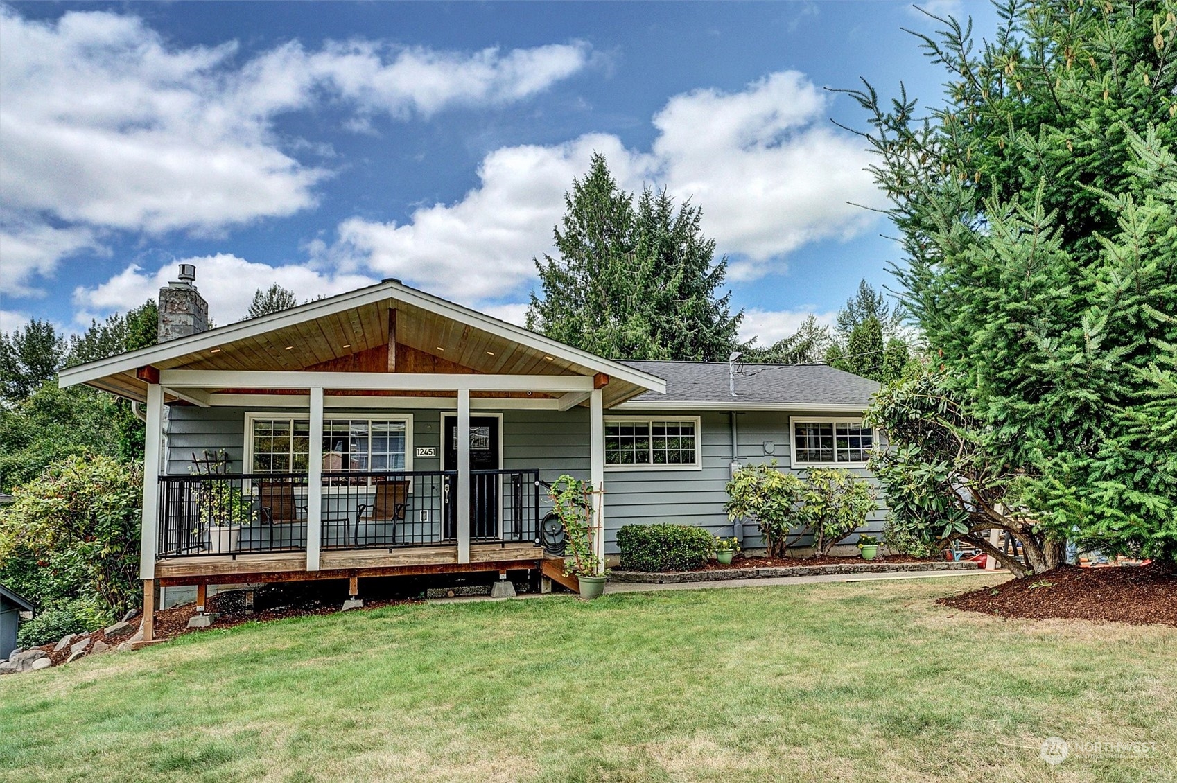 12451 169th Avenue Southeast Renton, WA 98059 - Photo 3 of 40 a view of a house with a yard