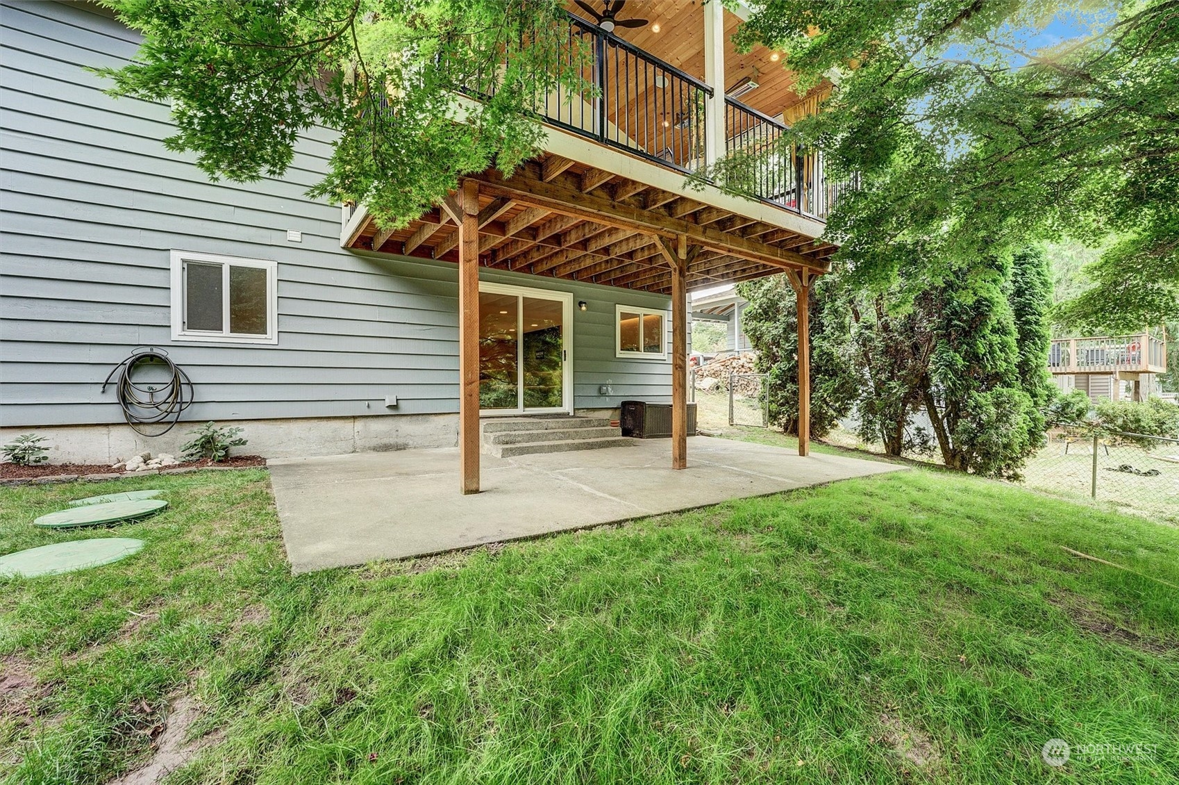 12451 169th Avenue Southeast Renton, WA 98059 - Photo 33 of 40 a view of a house with backyard and a tree