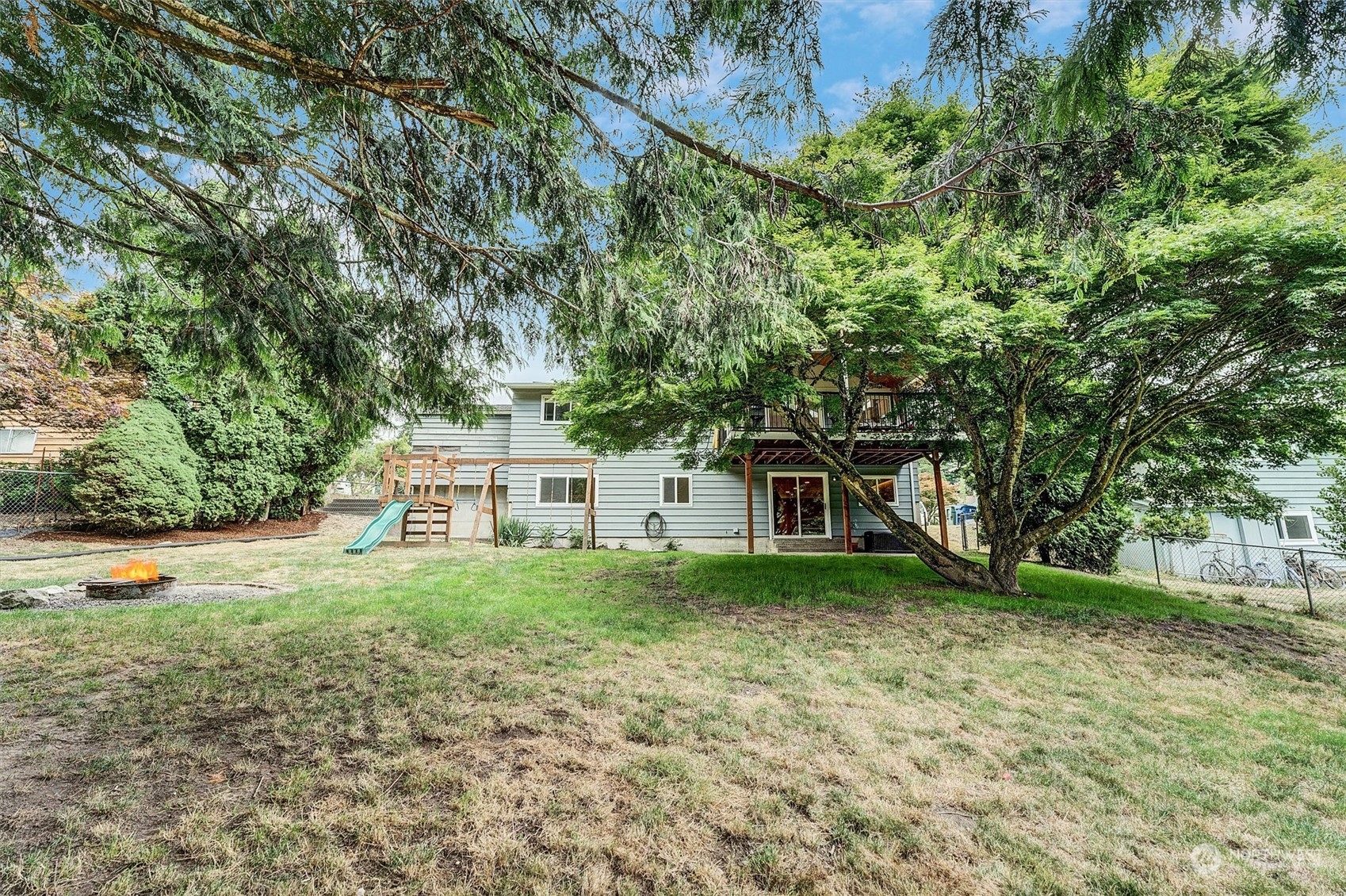 12451 169th Avenue Southeast Renton, WA 98059 - Photo 34 of 40 a house with trees in front of it