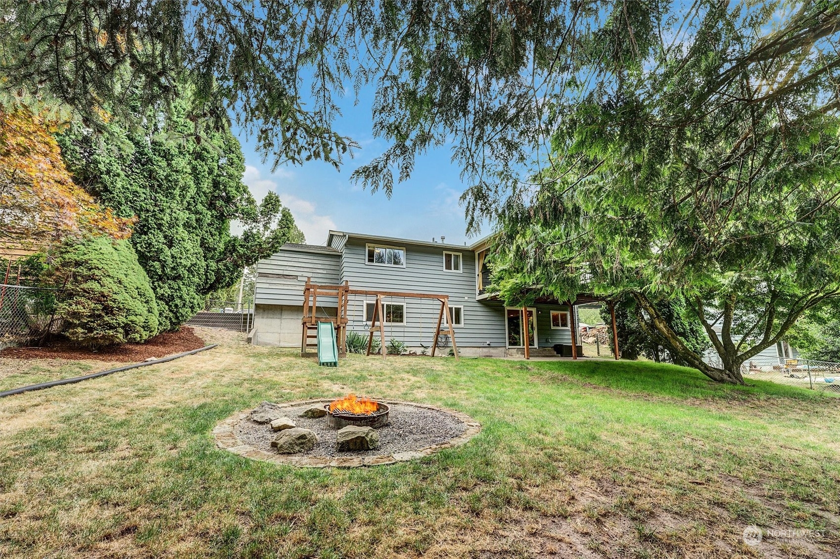 12451 169th Avenue Southeast Renton, WA 98059 - Photo 35 of 40 a front view of a house with garden