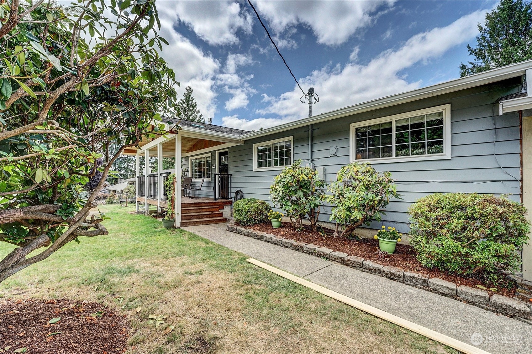 12451 169th Avenue Southeast Renton, WA 98059 - Photo 36 of 40 a front view of a house with garden