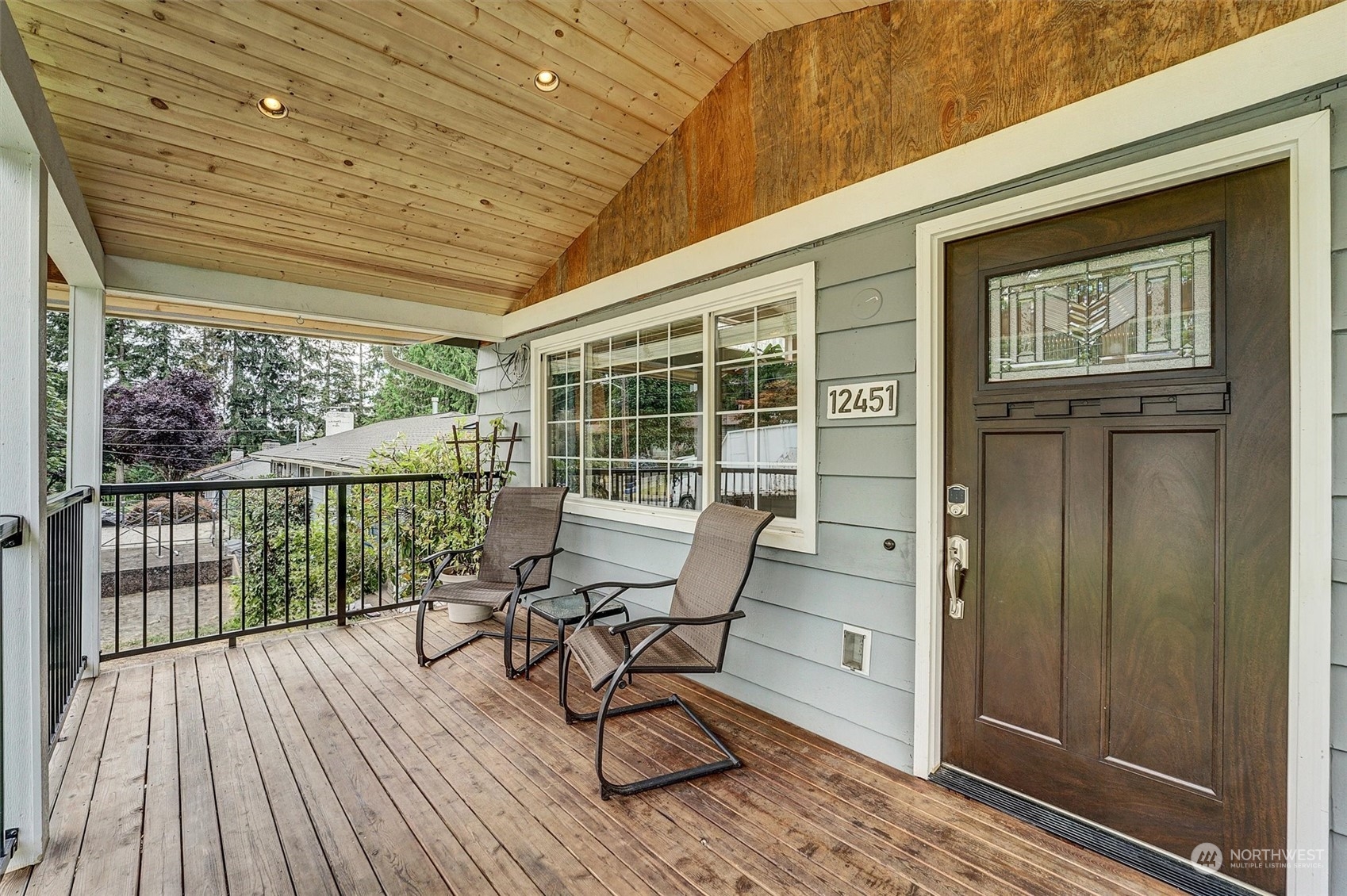 12451 169th Avenue Southeast Renton, WA 98059 - Photo 4 of 40 a view of a balcony with furniture and wooden floor