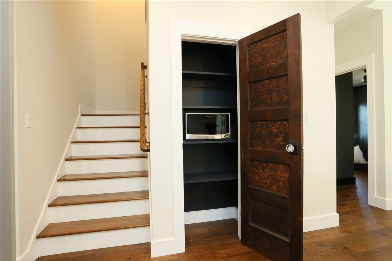 1007 South Person Street Raleigh, NC 27601 - Photo 10 of 25 The pantry in the kitchen is complete with a reclaimed door and electrical inside. Pantry