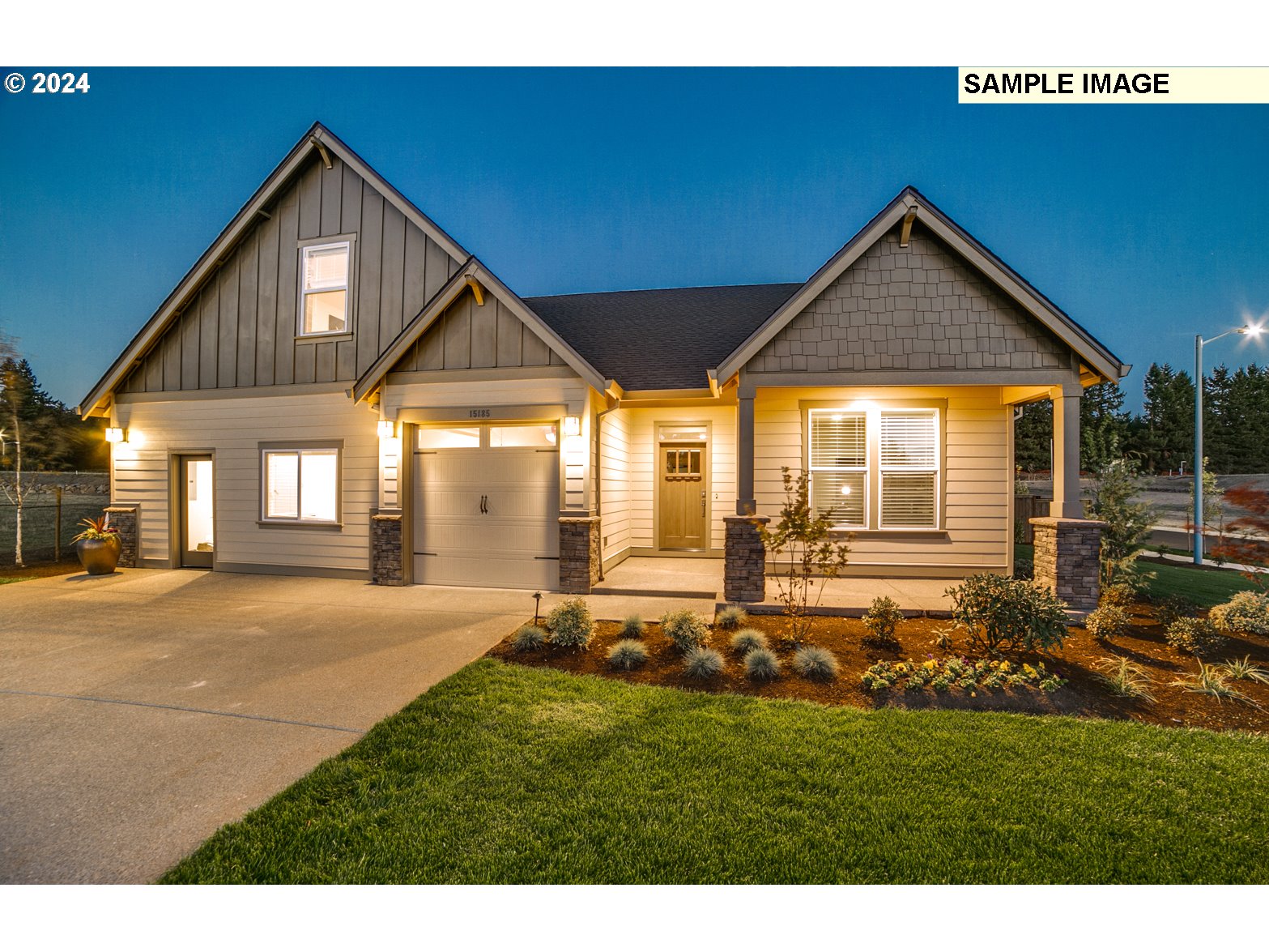 1344 North Kalani Loop, Unit LOT 65 Ridgefield, WA 98642 - Photo 19 of 24 a front view of a house with a yard