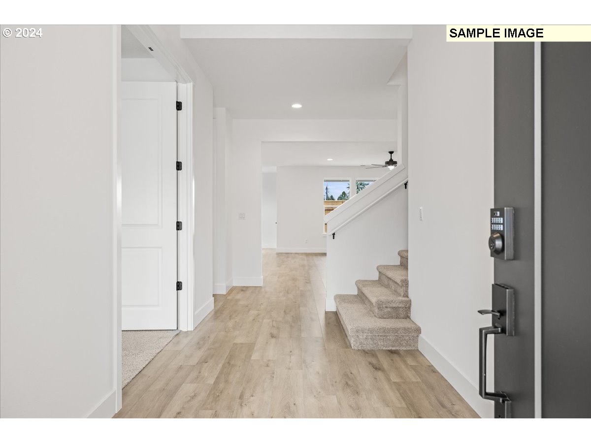 1344 North Kalani Loop, Unit LOT 65 Ridgefield, WA 98642 - Photo 2 of 24 a view of entryway with wooden floor