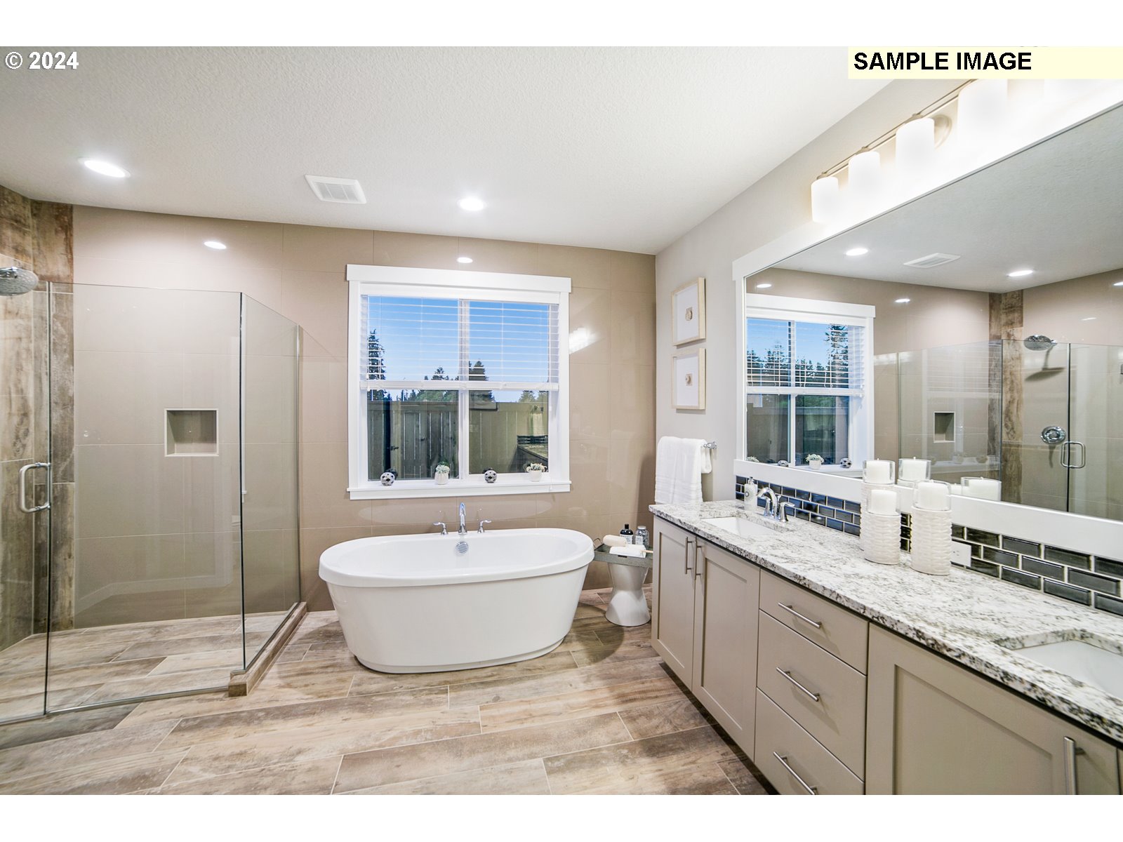 1344 North Kalani Loop, Unit LOT 65 Ridgefield, WA 98642 - Photo 6 of 24 a spacious bathroom with a double vanity sink a mirror and a bathtub