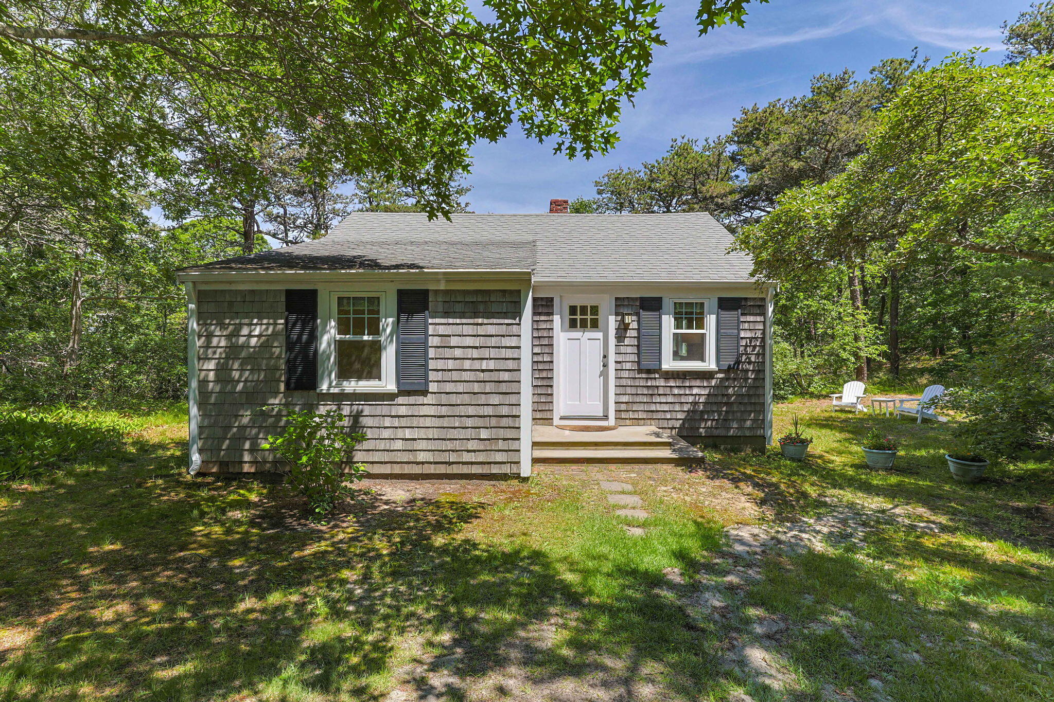 11 Whitmanville Road Truro, MA 02666 - Photo 2 of 31 a front view of a house with garden