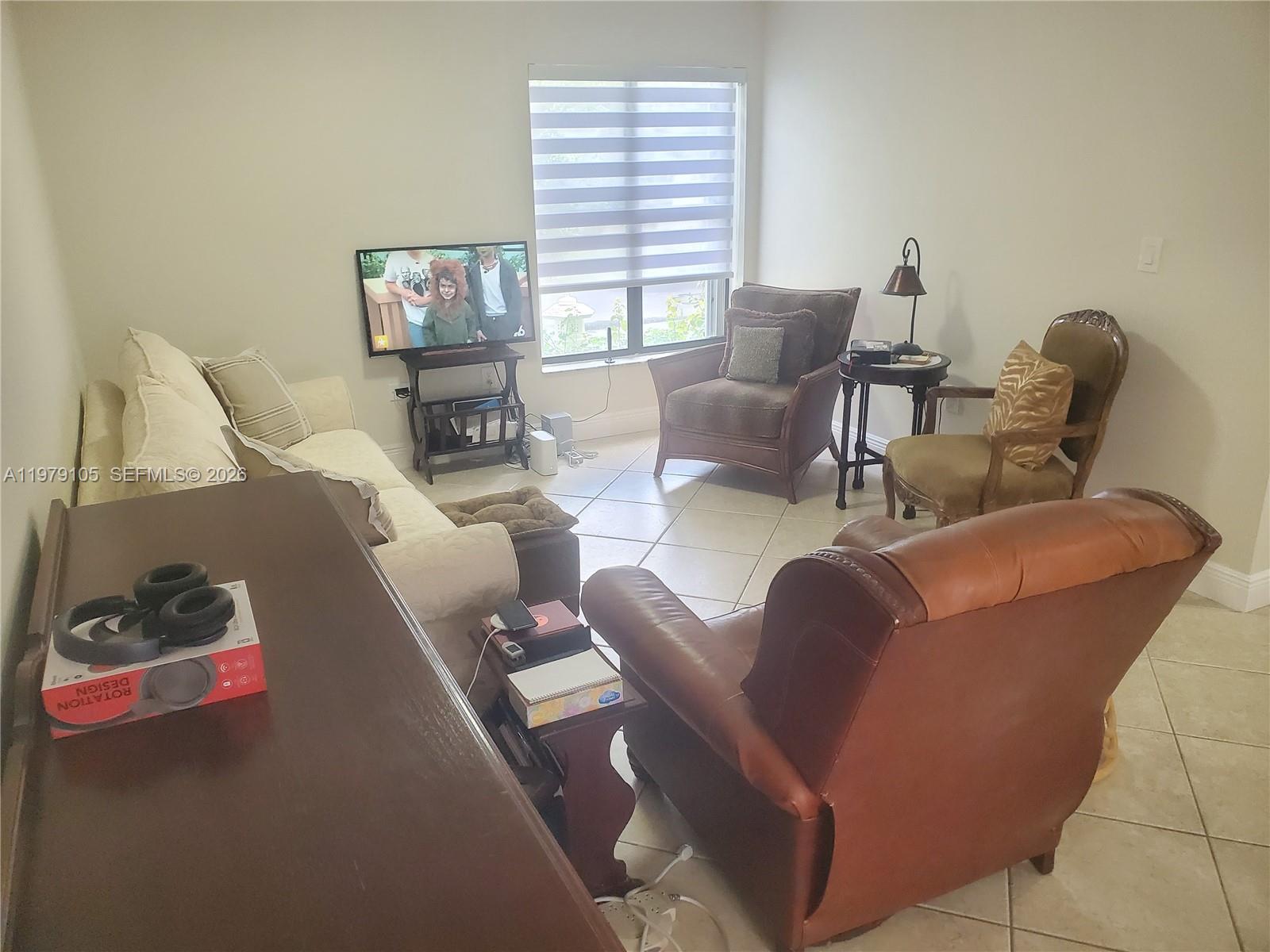 536 Southwest 88th Court Miami, FL 33174 - Photo 5 of 10 a living room with furniture and a window