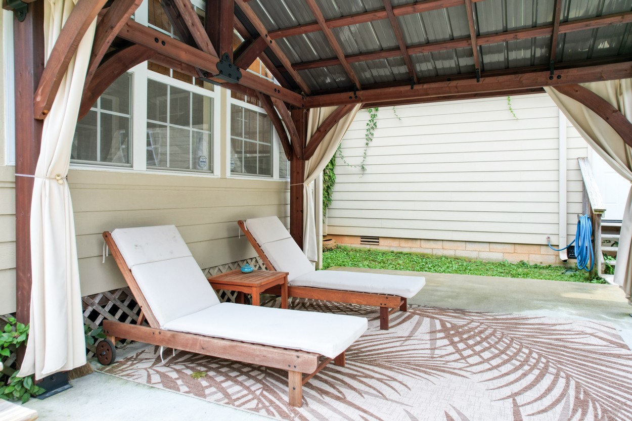 1775 Beckwith Road Mount Juliet, TN 37122 - Photo 11 of 64 a view of a patio with table and chairs with wooden floor and fence