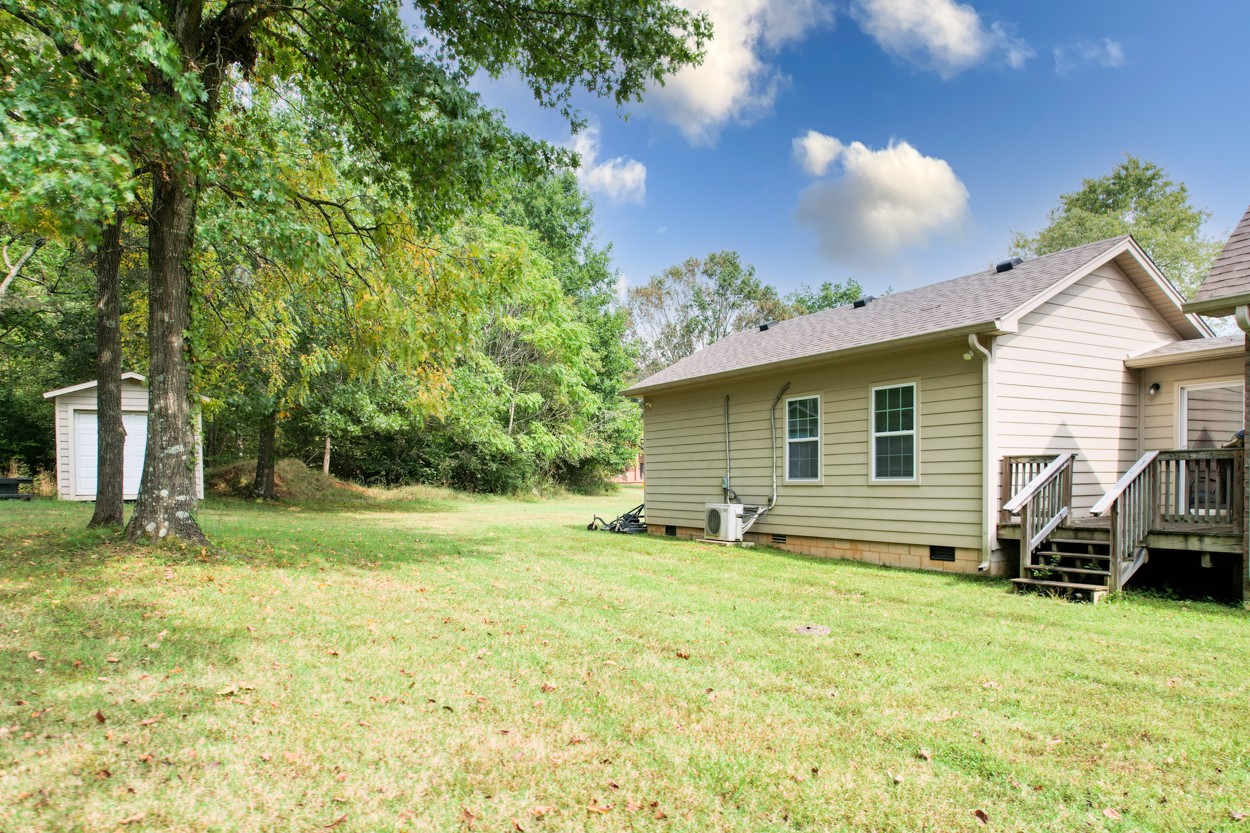 1775 Beckwith Road Mount Juliet, TN 37122 - Photo 16 of 64 a view of a house with backyard and a tree