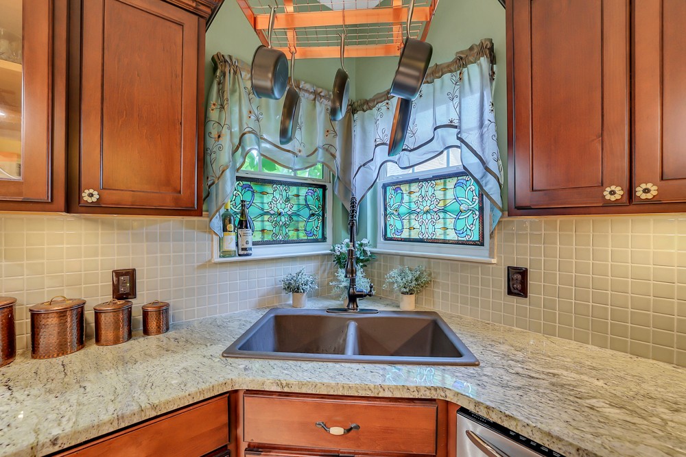 1775 Beckwith Road Mount Juliet, TN 37122 - Photo 35 of 64 a kitchen with stainless steel appliances granite countertop a sink a stove and a wooden cabinets