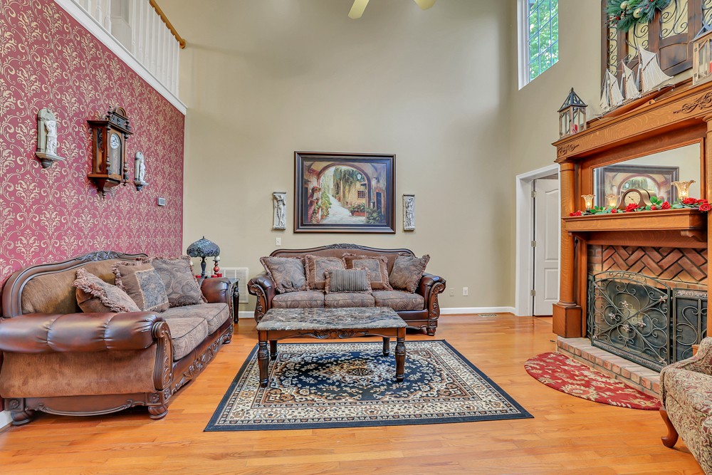 1775 Beckwith Road Mount Juliet, TN 37122 - Photo 44 of 64 a living room with furniture and a fireplace