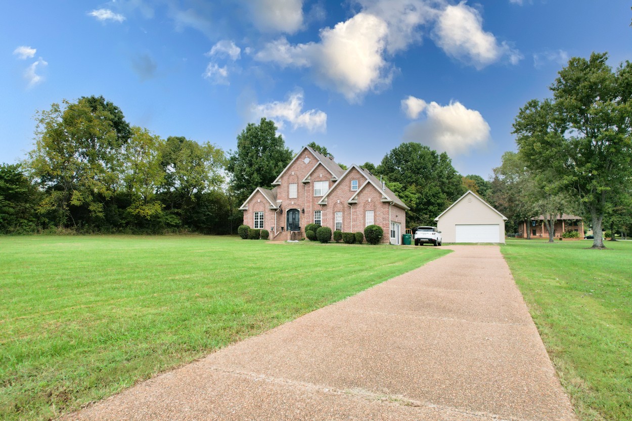 1775 Beckwith Road Mount Juliet, TN 37122 - Photo 8 of 64 a view of a large garden with plants and large trees