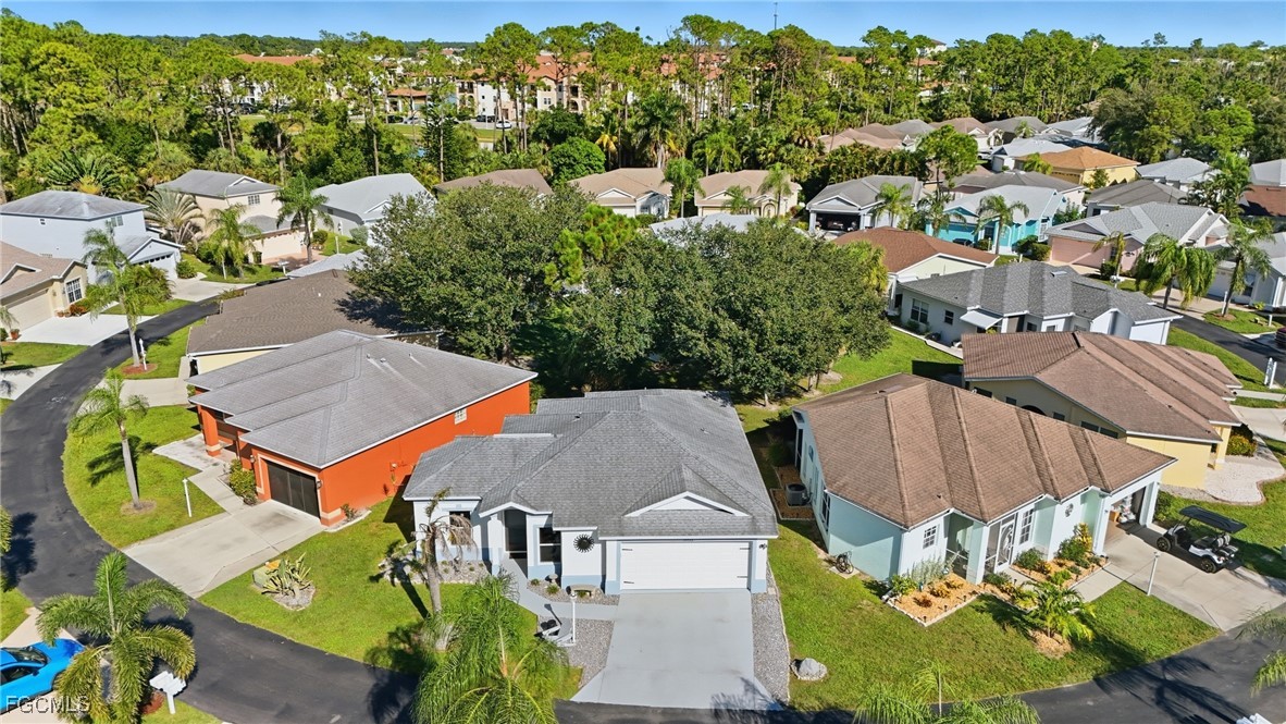 an aerial view of multiple houses with yard