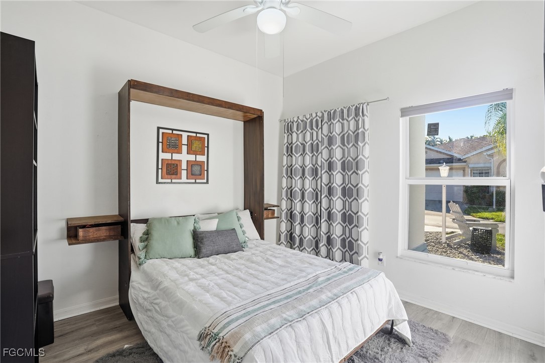 10733 Rio Mar Circle Estero, FL 33928 - Photo 12 of 40 a bedroom with a bed and a window