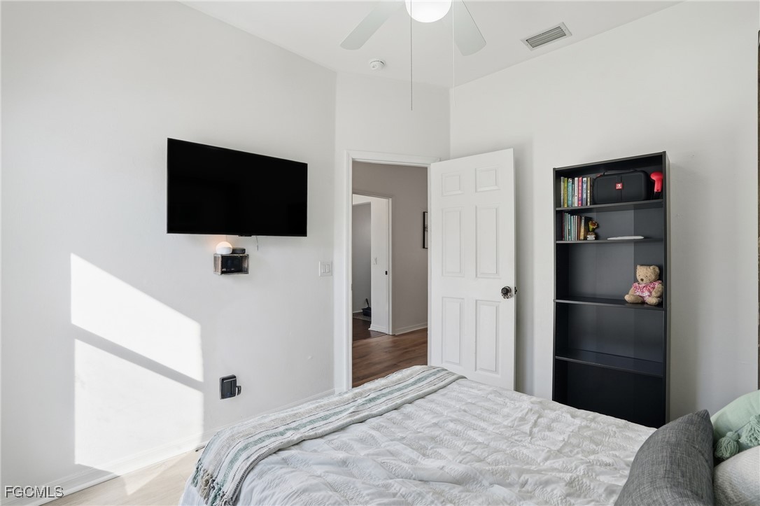 10733 Rio Mar Circle Estero, FL 33928 - Photo 13 of 40 a bedroom with a bed and a flat screen tv