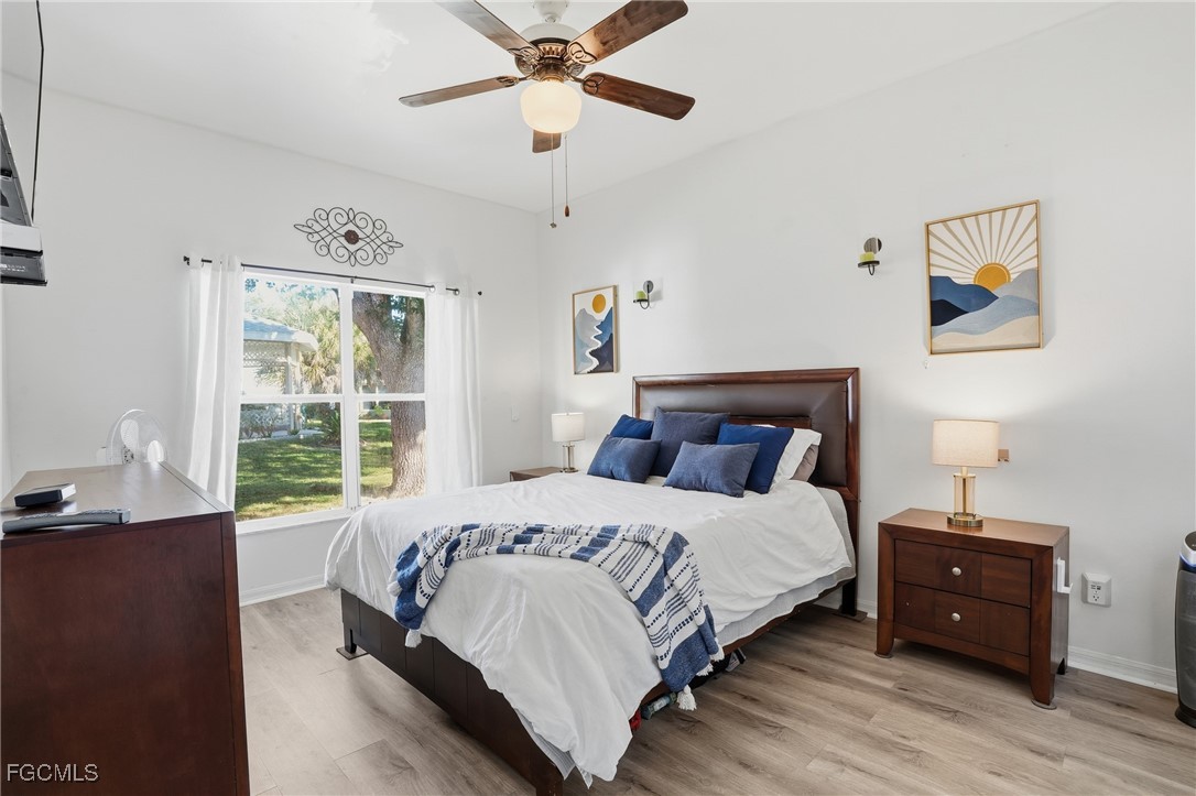 10733 Rio Mar Circle Estero, FL 33928 - Photo 15 of 40 a bedroom with a bed and a window