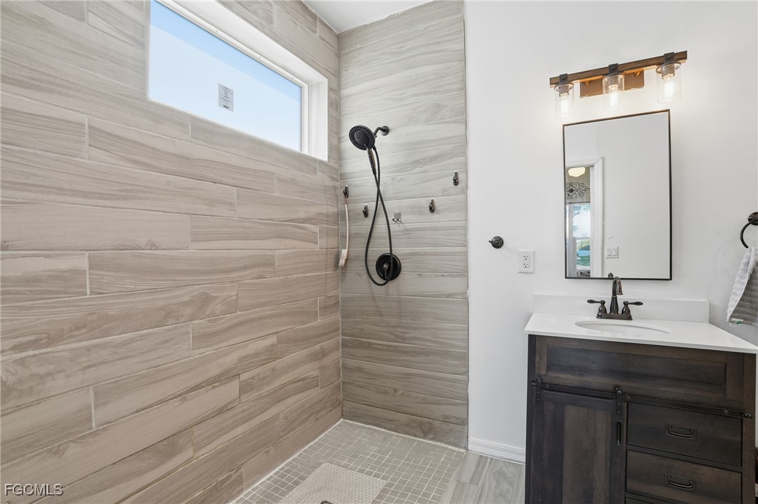 10733 Rio Mar Circle Estero, FL 33928 - Photo 18 of 40 a bathroom with a shower