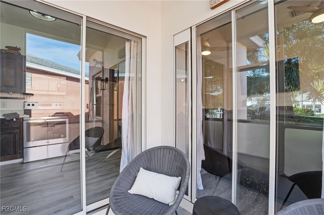 10733 Rio Mar Circle Estero, FL 33928 - Photo 20 of 40 a kitchen with a refrigerator and table chair