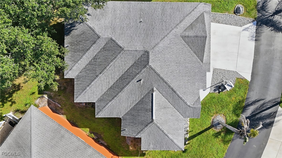 10733 Rio Mar Circle Estero, FL 33928 - Photo 22 of 40 a aerial view of a house with wooden fence