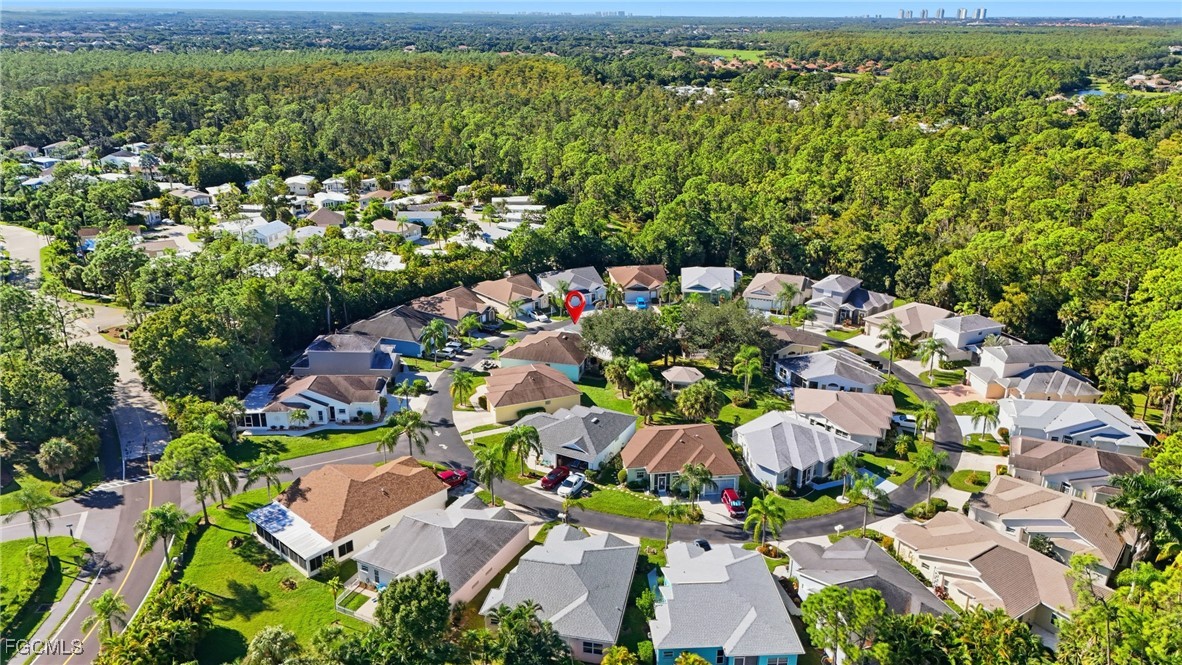 10733 Rio Mar Circle Estero, FL 33928 - Photo 24 of 40 an aerial view of a house with a garden