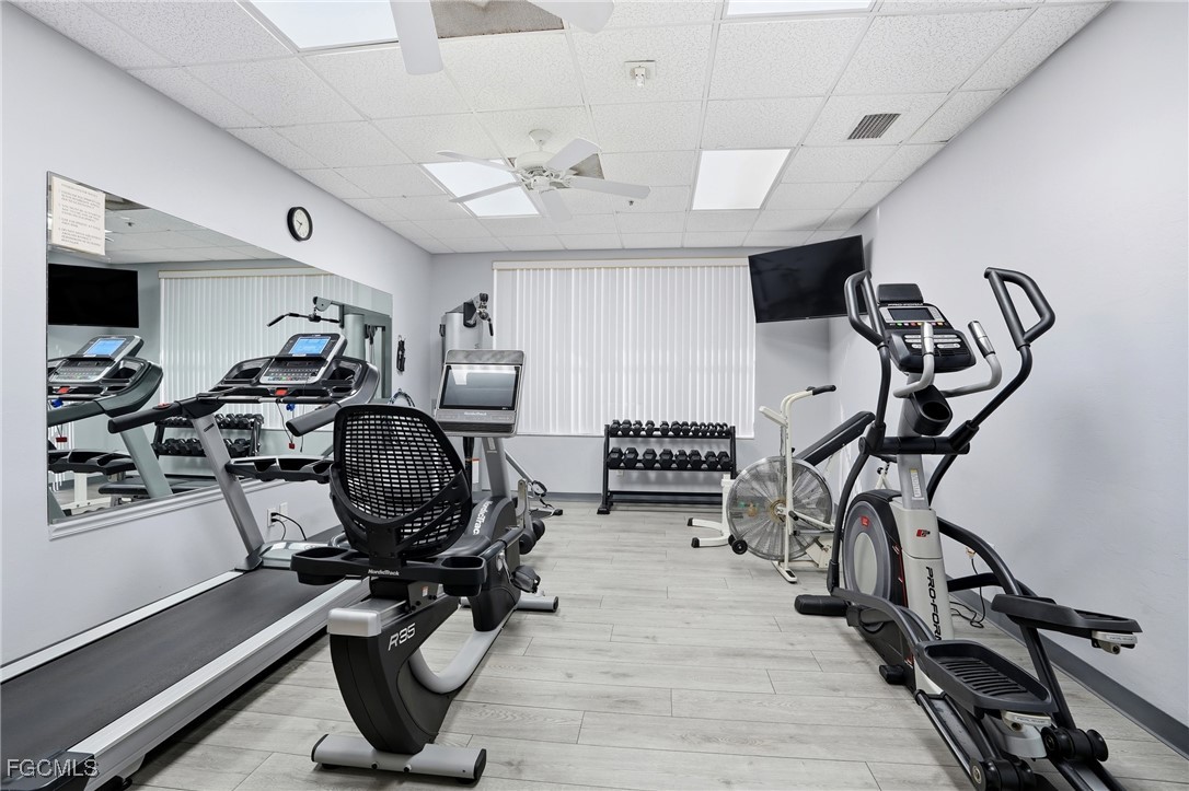 10733 Rio Mar Circle Estero, FL 33928 - Photo 30 of 40 a room with gym equipment and windows