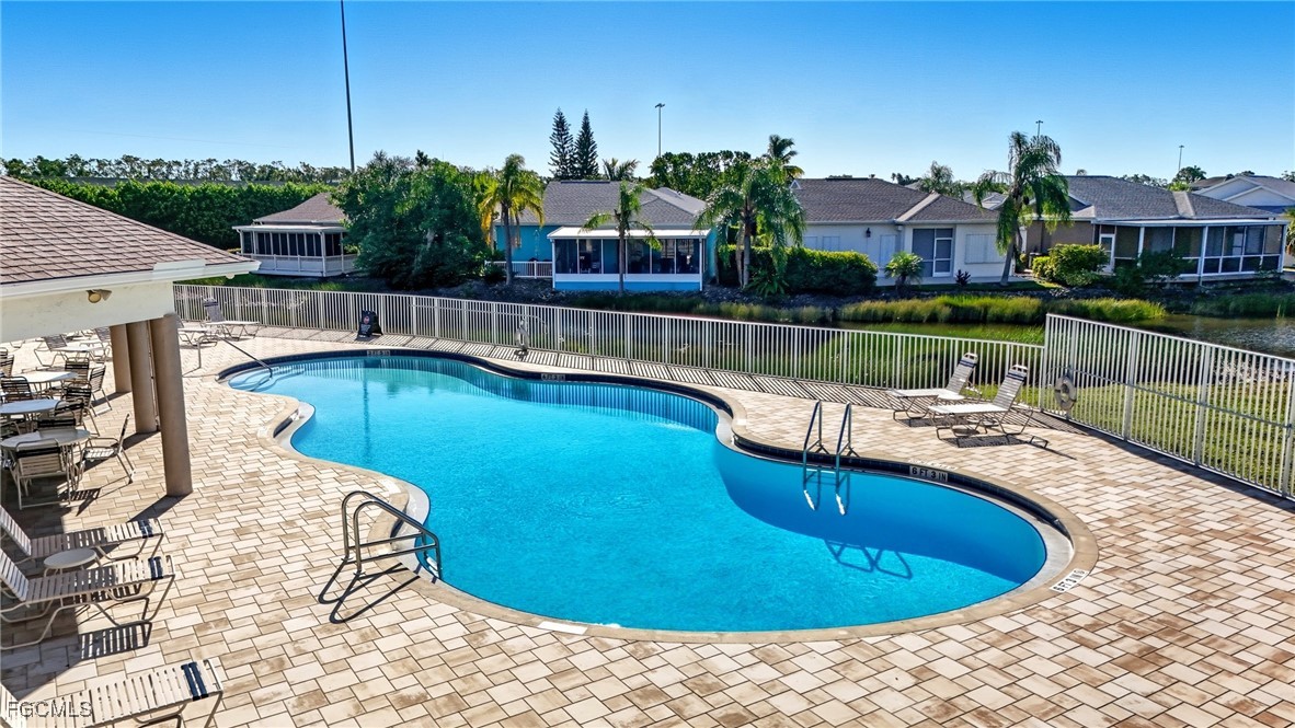 10733 Rio Mar Circle Estero, FL 33928 - Photo 32 of 40 a view of a swimming pool with a patio