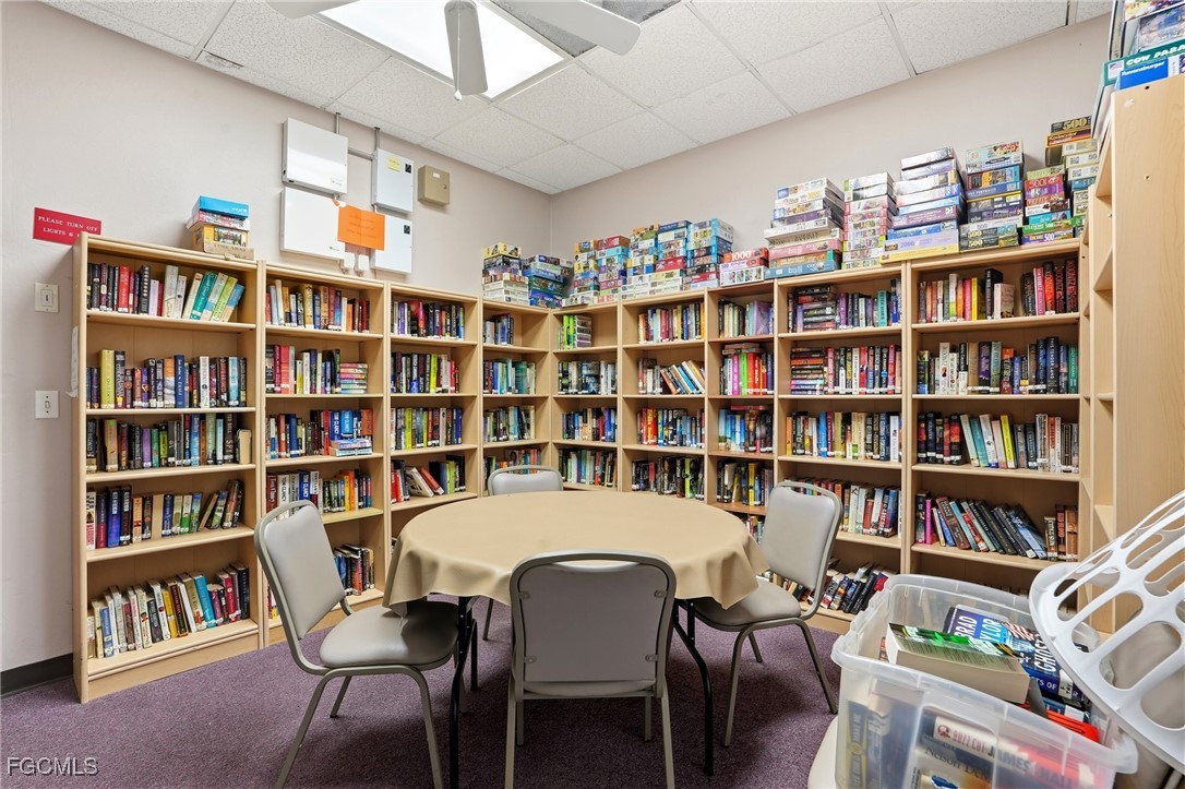 10733 Rio Mar Circle Estero, FL 33928 - Photo 37 of 40 a view of a livingroom with a bookshelf and a dining room